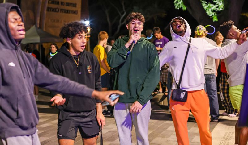 Mount Mercy students singing karaoke